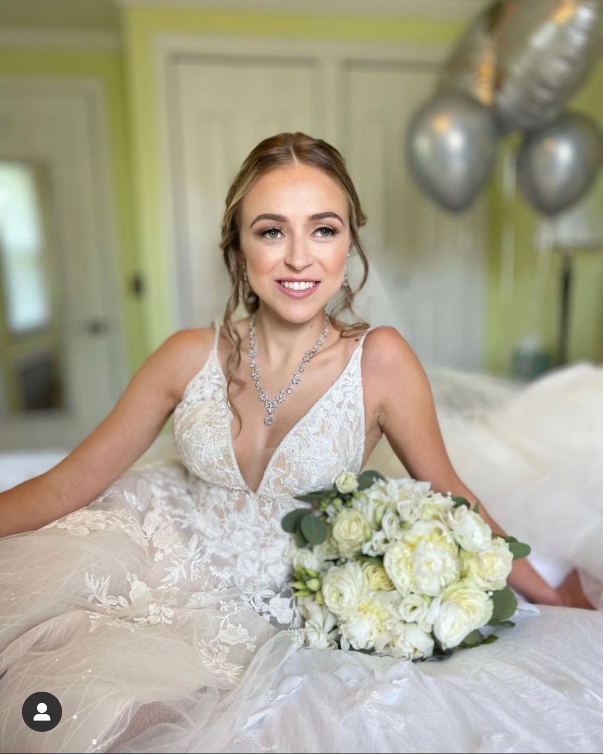 Elegant bridal updo with soft glam makeup